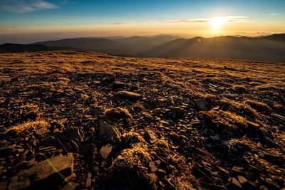 Scenic view of landscape against sky during sunset