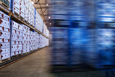 Blurred motion of warehouse full of boxes