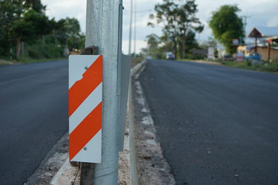 Close-up of road sign on street