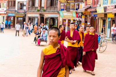 Portrait of people in town square