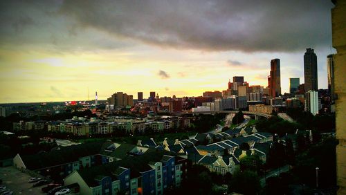 Cityscape against cloudy sky