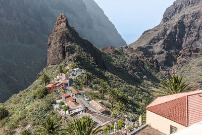 Panoramic view of buildings in town against sky