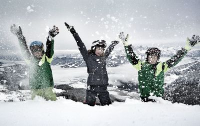 Group of people on snow covered landscape