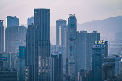 Skyscrapers in city against sky