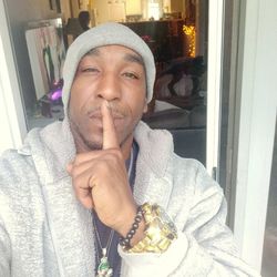 Portrait of young man wearing hat at home