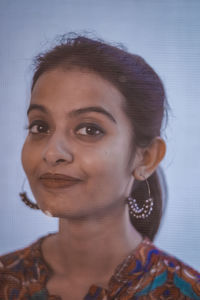 Close-up portrait of a serious young woman