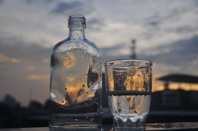 Close-up of glass bottle on table