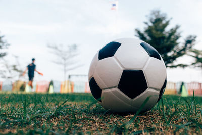 Close-up of soccer ball on playing field