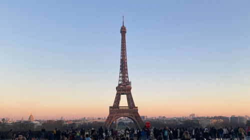 Low angle view of eiffel tower against sky during sunset