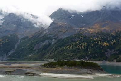 Scenic view of lake and mountains against sky