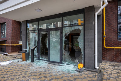 Entrance of the house fired upon by russian troops. broken glass.