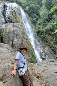 Full length of man standing on rock