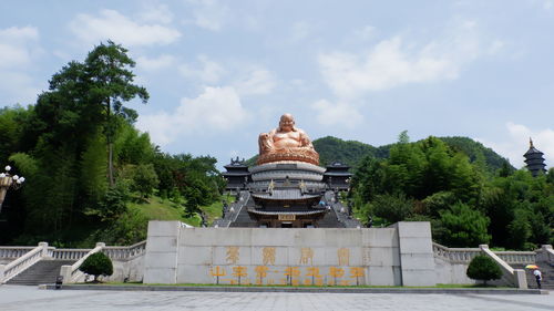 Low angle view of statue against cloudy sky