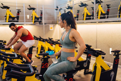 Portrait of young couple in love having a special moment in gym clothes