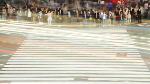 Blurred motion of people in city