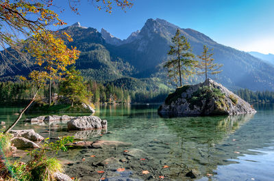 Scenic view of lake and mountains against sky