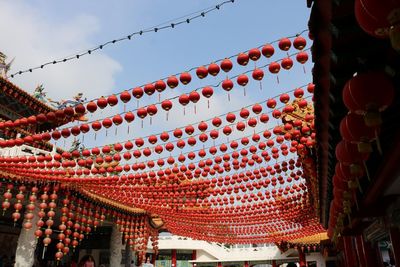 Low angle view of lanterns against sky