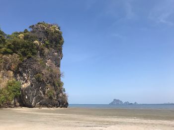 Scenic view of sea against blue sky