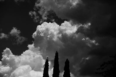 Low angle view of silhouette tower against sky