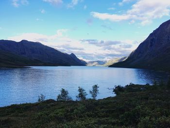 Scenic view of lake and mountains against sky