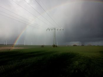 Electricity pylon on field