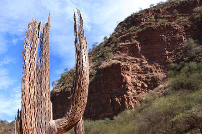 Low angle view of rocks against sky