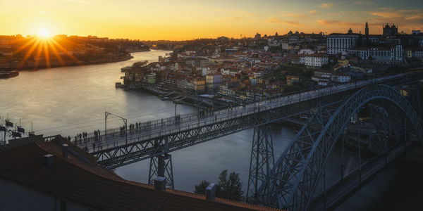 High angle view of bridge over river in city at night
