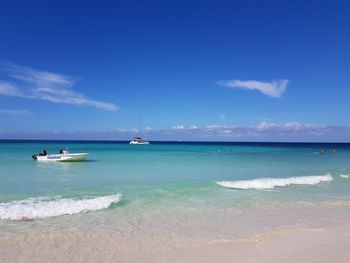 Scenic view of sea against blue sky
