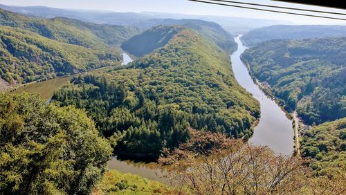 High angle view of trees and mountains against sky