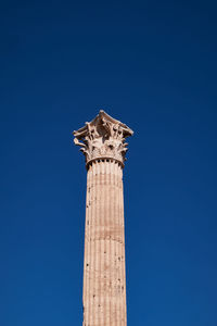 Low angle view of statue against clear blue sky