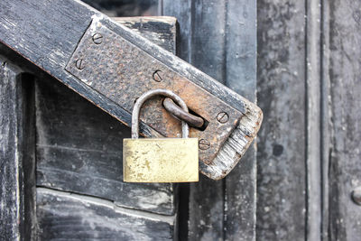Close-up of padlock on metallic door