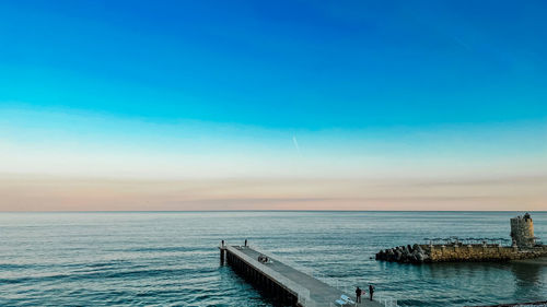 Pier going out to sea. sunset landscape on the black sea coast.