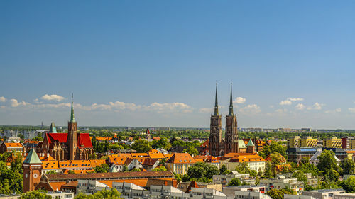 High angle view of townscape against clear blue sky