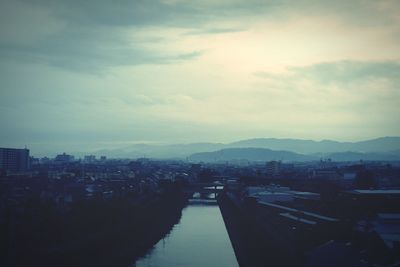 View of river against cloudy sky