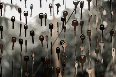 Full frame shot of keys hanging on strings