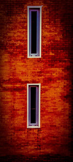 Full frame shot of window on brick wall of building
