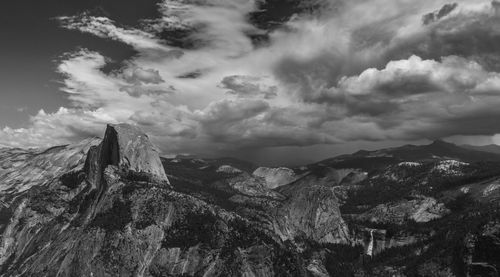 Scenic view of mountains against cloudy sky