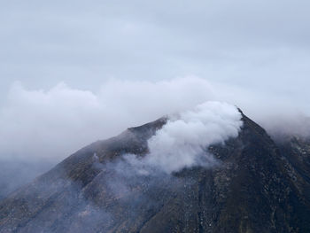 Scenic view of volcanic mountain against sky