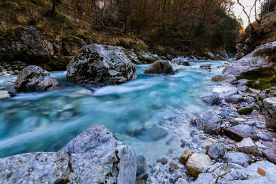 River flowing through rocks in forest