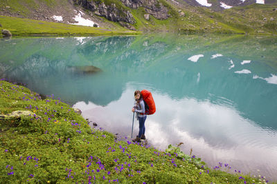 Man standing by lake