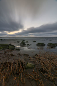 Scenic view of sea against sky during sunset