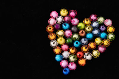 High angle view of multi colored pencils against black background