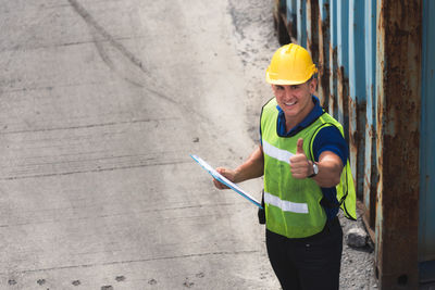 Man working with arms outstretched standing