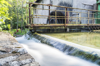 Scenic view of river flowing through dam