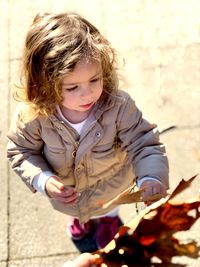 Cute girl with arms raised