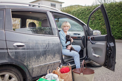 Ukrainian refugees flee from russian invasion, cross board by car together with pet, seek protection