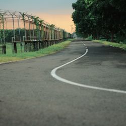 Empty road against sky