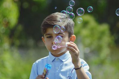 Portrait of boy with bubbles