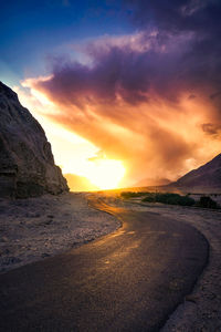 Scenic view of road against sky during sunset