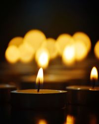 Close-up of illuminated light candles